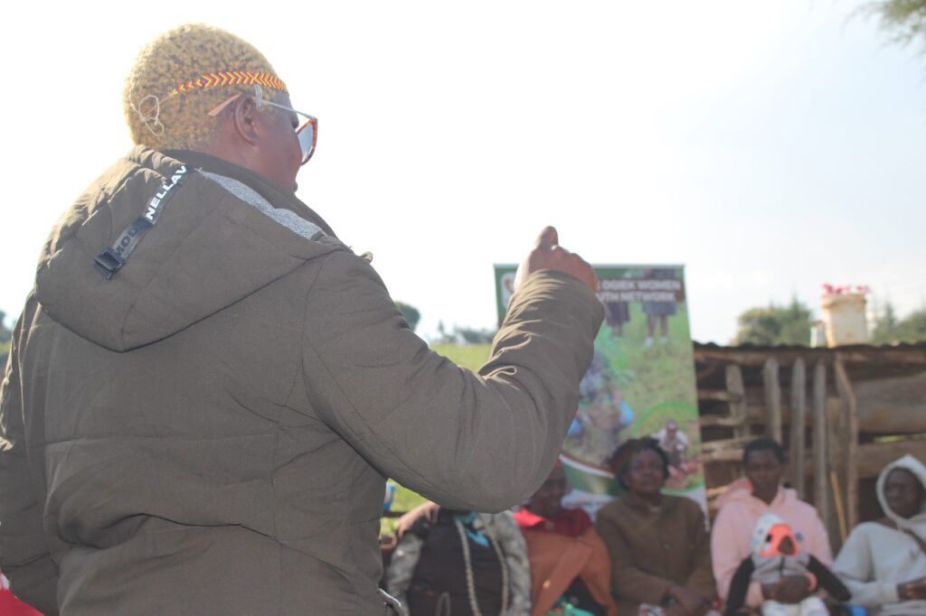 Judy Kipkenda facilitating a session with the Ogiek community.